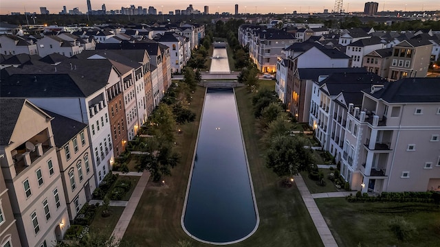 aerial view at dusk featuring a view of city