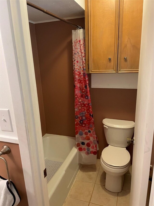 full bath with tile patterned flooring and toilet
