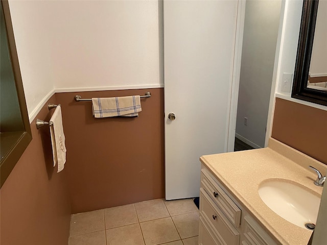 bathroom with tile patterned flooring and vanity