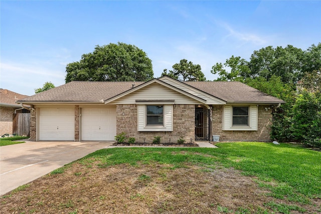 7226 Brook Stone Dr, Houston, TX 77040 - ranch-style house with a front lawn, roof with shingles, brick siding, an attached garage, and driveway