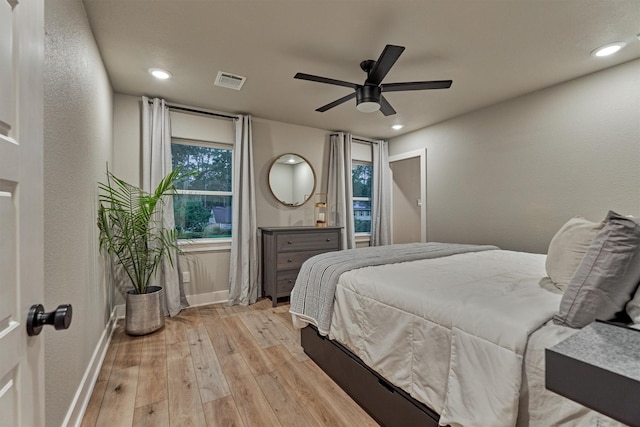 bedroom featuring light wood-style flooring, baseboards, a ceiling fan, and recessed lighting