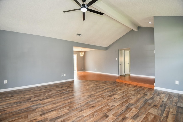 empty room with visible vents, wood finished floors, ceiling fan with notable chandelier, and beamed ceiling