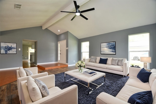 living area with wood finished floors, visible vents, beamed ceiling, a ceiling fan, and baseboards