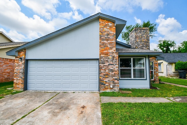 view of front of property featuring a chimney, brick siding, an attached garage, concrete driveway, and a front lawn