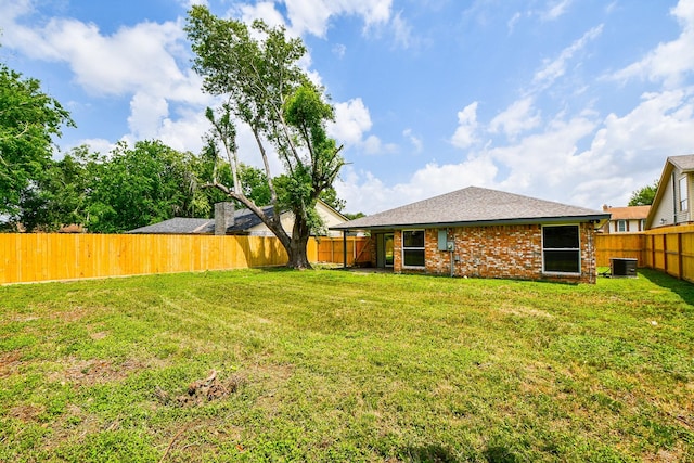 view of yard featuring cooling unit and a fenced backyard