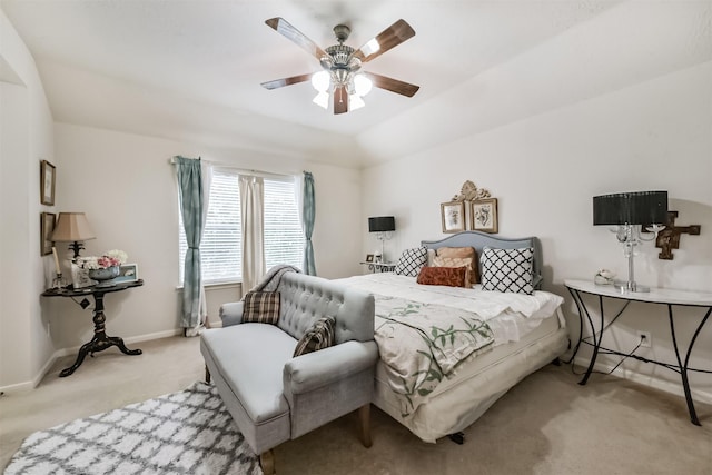 carpeted bedroom with baseboards and a ceiling fan