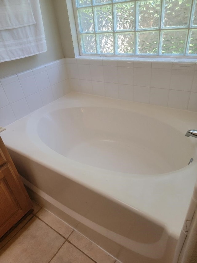 4526 Cannongate Dr, Spring Branch, TX 77373 - bathroom featuring a garden tub and tile patterned floors