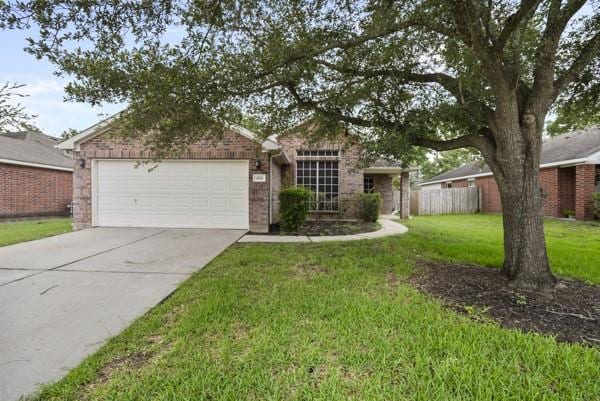 4526 Cannongate Dr, Spring Branch, TX 77373 - view of front of property with an attached garage, driveway, and brick siding