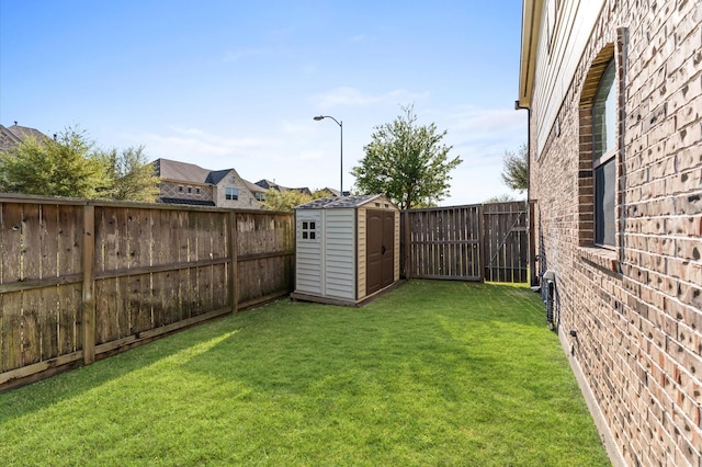31183 Pecan Creek Dr, Brookshire, TX 77423 - view of yard featuring a fenced backyard, an outbuilding, and a storage shed