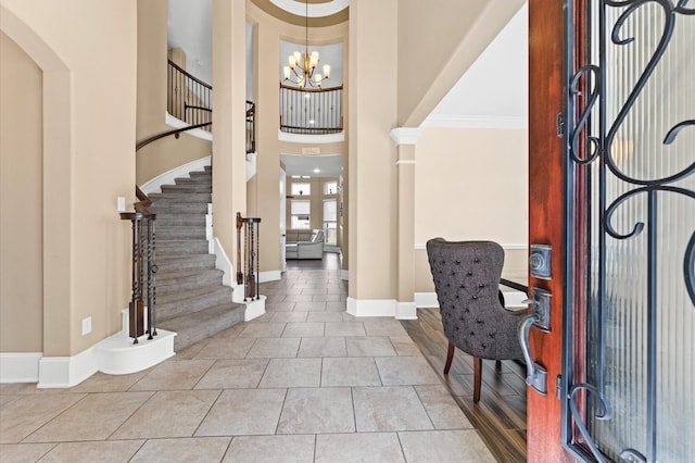 31183 Pecan Creek Dr, Brookshire, TX 77423 - foyer entrance with stairs, baseboards, a chandelier, and ornamental molding