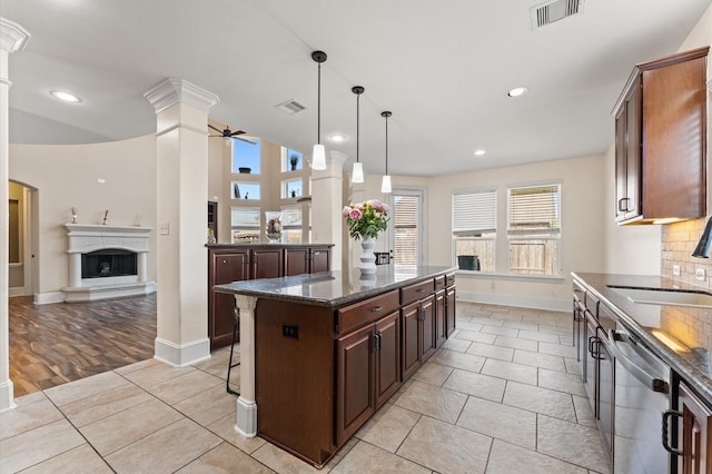 31183 Pecan Creek Dr, Brookshire, TX 77423 - kitchen with visible vents, a sink, ornate columns, and dishwasher