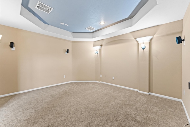 31183 Pecan Creek Dr, Brookshire, TX 77423 - carpeted cinema room with a tray ceiling, visible vents, and baseboards