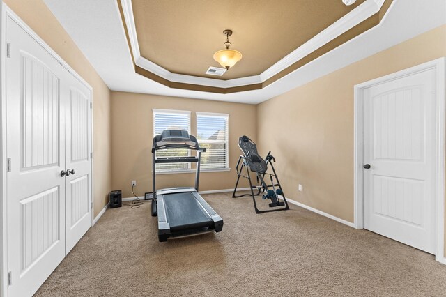 31183 Pecan Creek Dr, Brookshire, TX 77423 - workout area featuring visible vents, crown molding, a raised ceiling, baseboards, and carpet floors