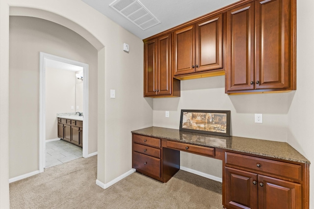 31183 Pecan Creek Dr, Brookshire, TX 77423 - unfurnished office featuring built in study area, baseboards, light carpet, and visible vents