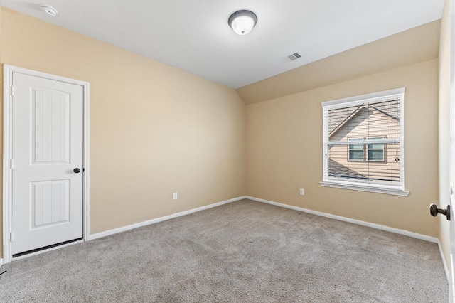 31183 Pecan Creek Dr, Brookshire, TX 77423 - empty room featuring visible vents, carpet, baseboards, and vaulted ceiling