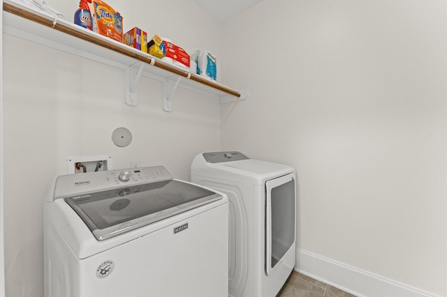 31183 Pecan Creek Dr, Brookshire, TX 77423 - laundry area with baseboards, laundry area, light tile patterned flooring, and washer and dryer