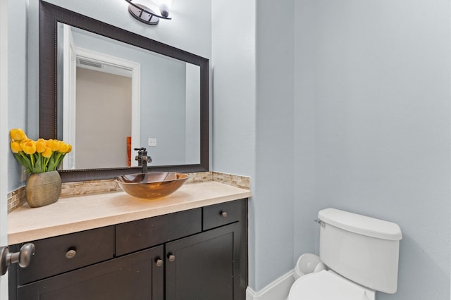 31183 Pecan Creek Dr, Brookshire, TX 77423 - half bathroom featuring vanity, toilet, and visible vents