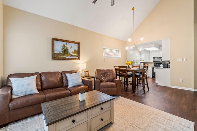 14854 Altair Ct, Willis, TX 77318 - living room with high vaulted ceiling, ceiling fan, baseboards, and dark wood finished floors