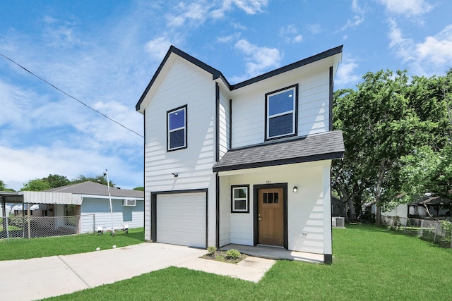 view of front of property with a front yard, fence, concrete driveway, an attached garage, and a shingled roof