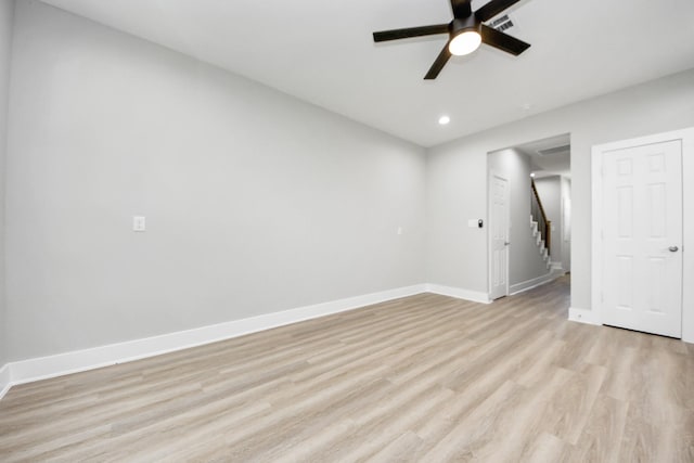 spare room with a ceiling fan, baseboards, recessed lighting, and light wood-style floors