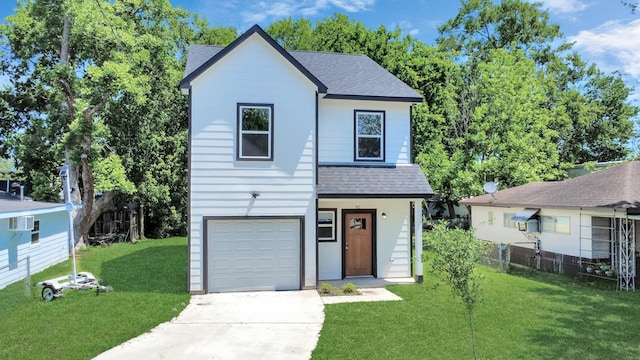 view of front of property featuring a front lawn, fence, a shingled roof, an attached garage, and driveway