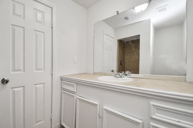 bathroom featuring visible vents and vanity
