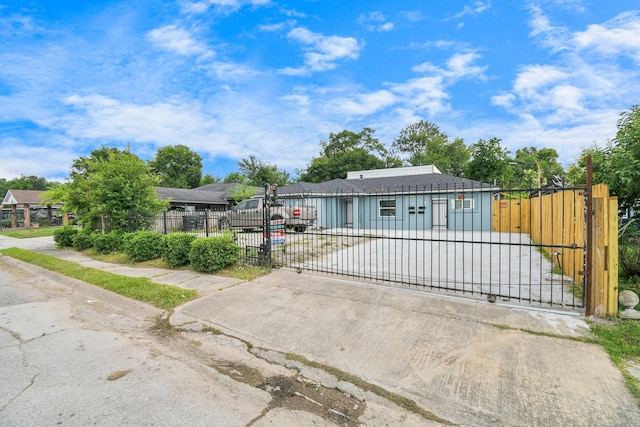 view of front of home featuring a fenced front yard and a gate
