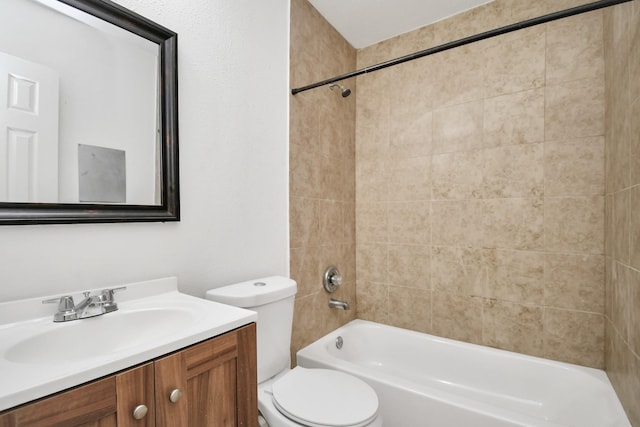 bathroom with vanity, bathtub / shower combination, and toilet