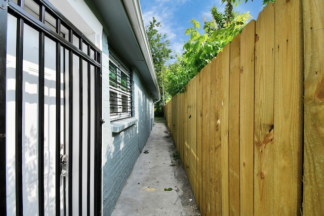 view of side of property featuring fence