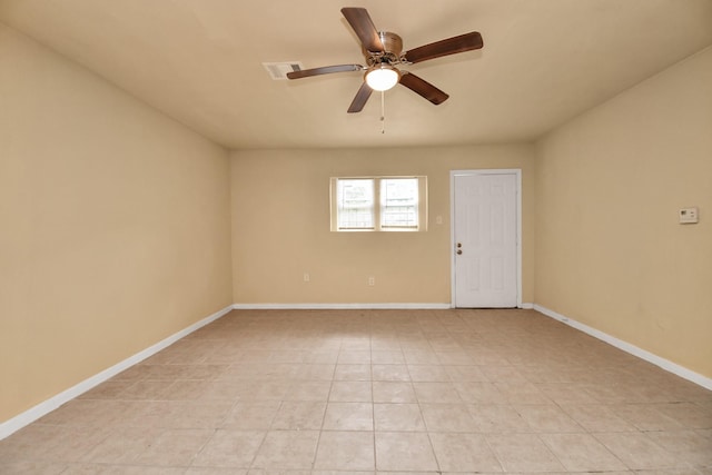 unfurnished room featuring light tile patterned floors, baseboards, a ceiling fan, and visible vents