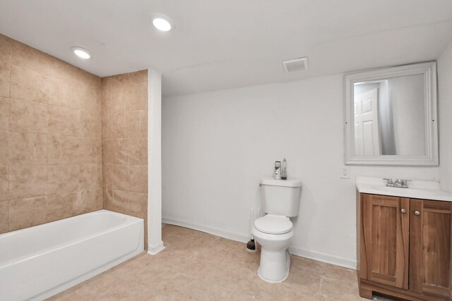 bathroom with vanity, toilet, tile patterned floors, baseboards, and visible vents