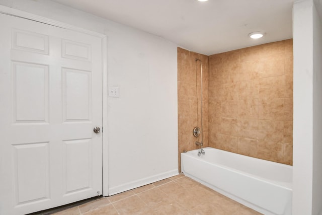 full bath with tile patterned floors, washtub / shower combination, and baseboards