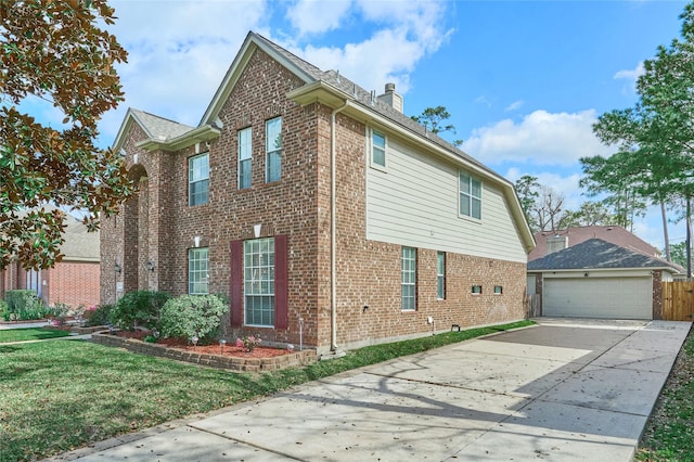19106 S Rim Trl, Spring, TX 77388 - view of side of property featuring brick siding, a lawn, driveway, and a chimney