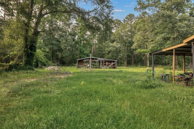 4205 Trent Rd, Huffman, TX 77336 - view of yard with a view of trees