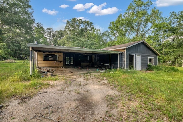 4205 Trent Rd, Huffman, TX 77336 - view of outdoor structure with driveway and a carport
