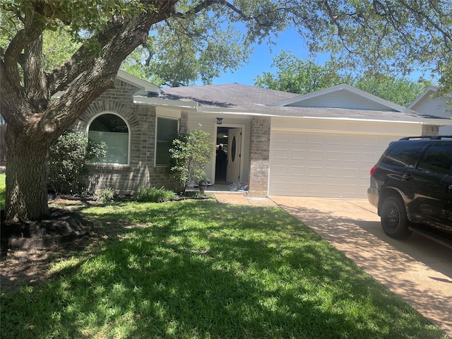 20018 Big Timber Dr, Humble, TX 77346 - ranch-style home featuring brick siding, a garage, a front yard, and concrete driveway