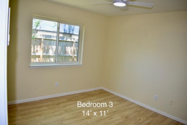 20018 Big Timber Dr, Humble, TX 77346 - spare room featuring wood finished floors, a ceiling fan, and baseboards