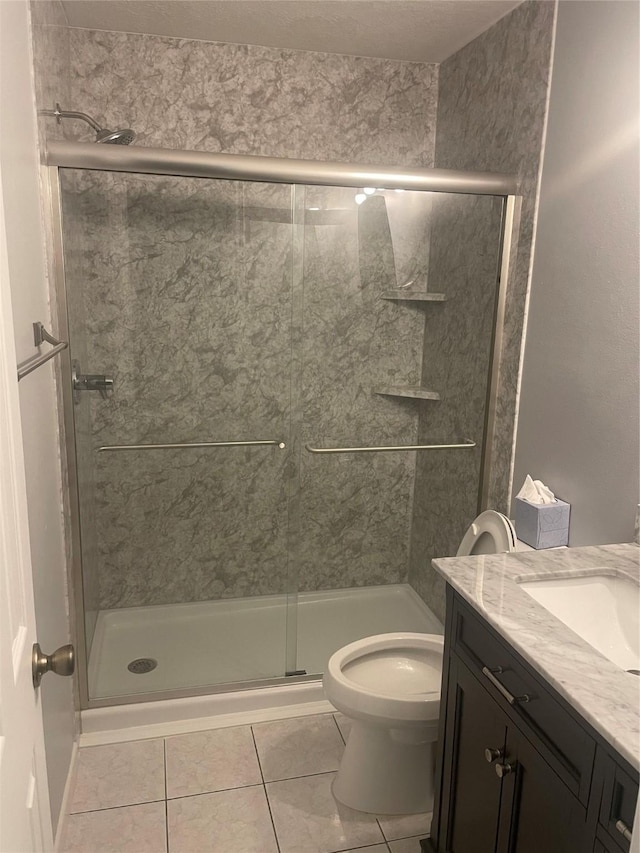 20018 Big Timber Dr, Humble, TX 77346 - bathroom with a stall shower, tile patterned floors, toilet, and vanity