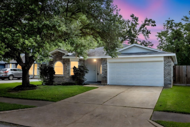 20018 Big Timber Dr, Humble, TX 77346 - ranch-style home featuring driveway, an attached garage, brick siding, and stone siding