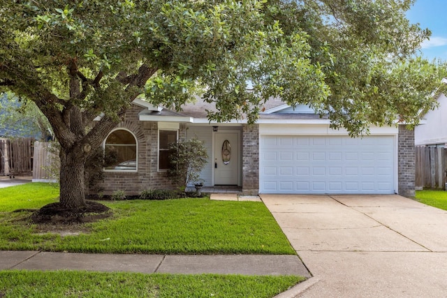 20018 Big Timber Dr, Humble, TX 77346 - obstructed view of property featuring driveway, brick siding, and an attached garage