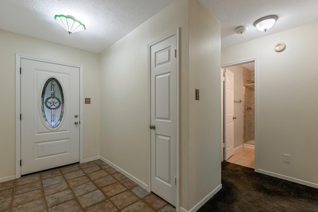 20018 Big Timber Dr, Humble, TX 77346 - entrance foyer featuring a textured ceiling and baseboards