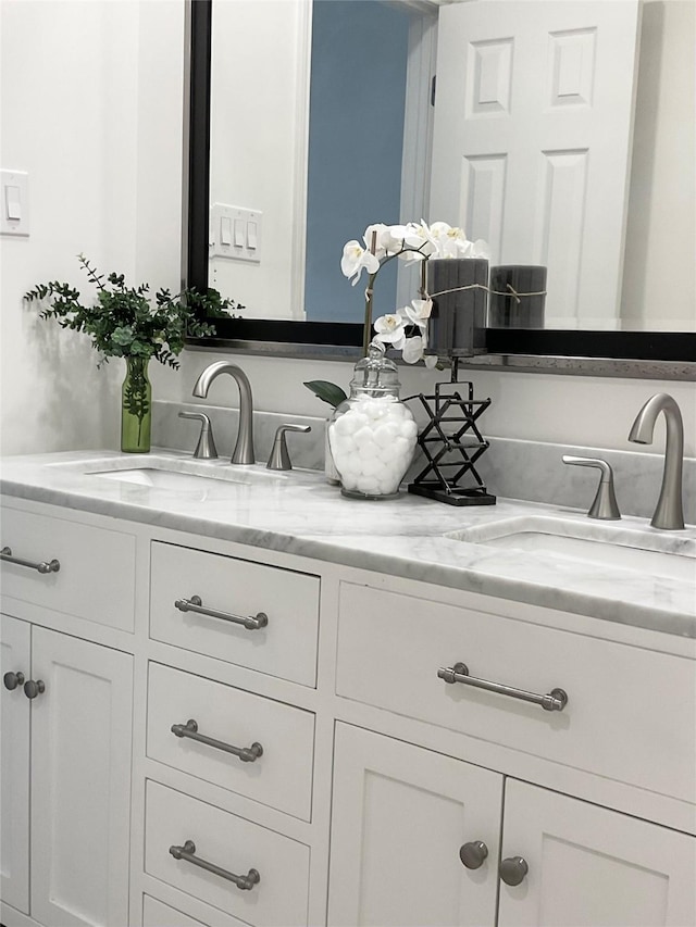 bathroom with double vanity and a sink