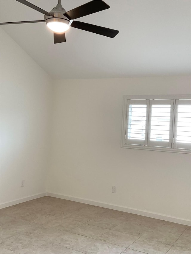 unfurnished room with baseboards, ceiling fan, and lofted ceiling