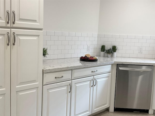 bar with stainless steel dishwasher and tasteful backsplash