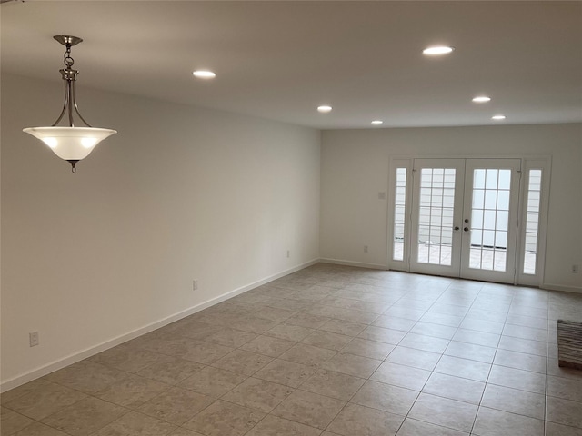 empty room featuring recessed lighting, baseboards, light tile patterned flooring, and french doors