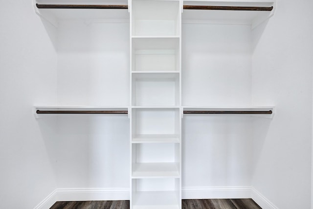 2104 Bringhurst St, Houston, TX 77026 - walk in closet with dark wood-style flooring