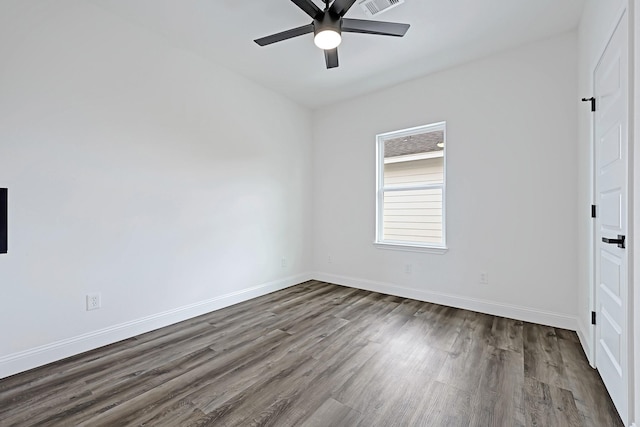2104 Bringhurst St, Houston, TX 77026 - spare room with dark wood-style flooring, ceiling fan, and baseboards