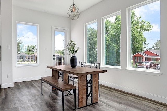 2104 Bringhurst St, Houston, TX 77026 - dining room with healthy amount of natural light, dark wood-style flooring, and baseboards