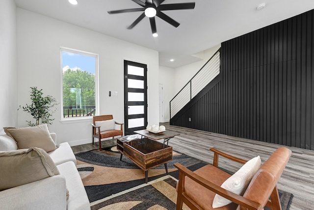 2104 Bringhurst St, Houston, TX 77026 - living area with wood finished floors, ceiling fan, stairway, and recessed lighting