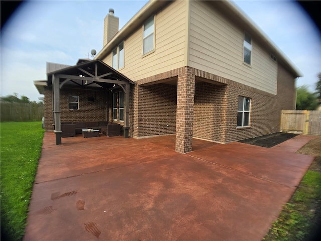 3905 Austin Lake Ct, Pearland, TX 77581 - back of house with fence, a patio, a chimney, an outdoor hangout area, and brick siding